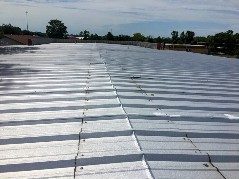 Business needing Huntsville Commercial Roofing services with Light Colored Metal Roof.